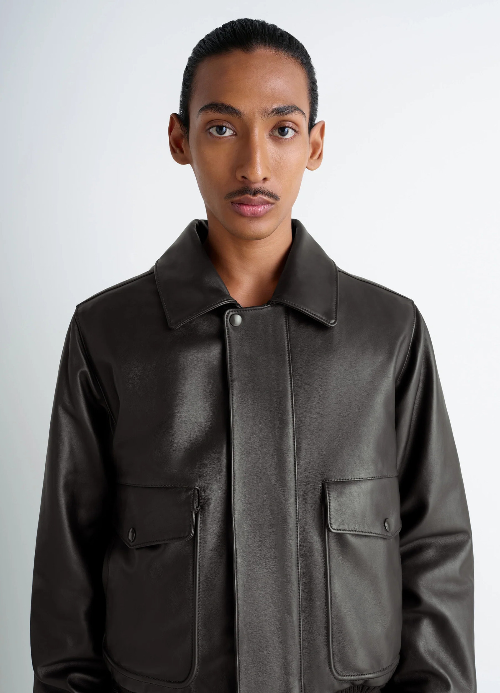 Lemaire leather blouson in brown cow leather, model shot, close-up front view large flap pockets