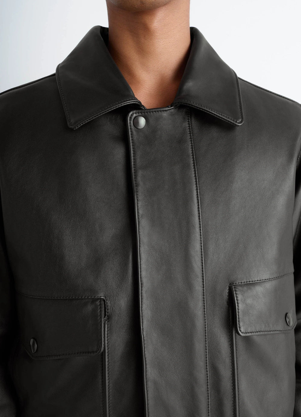 Lemaire Leather Blouson in Brown Cow Leather, model shot, close-up detail view buttoned placket, pointed collar