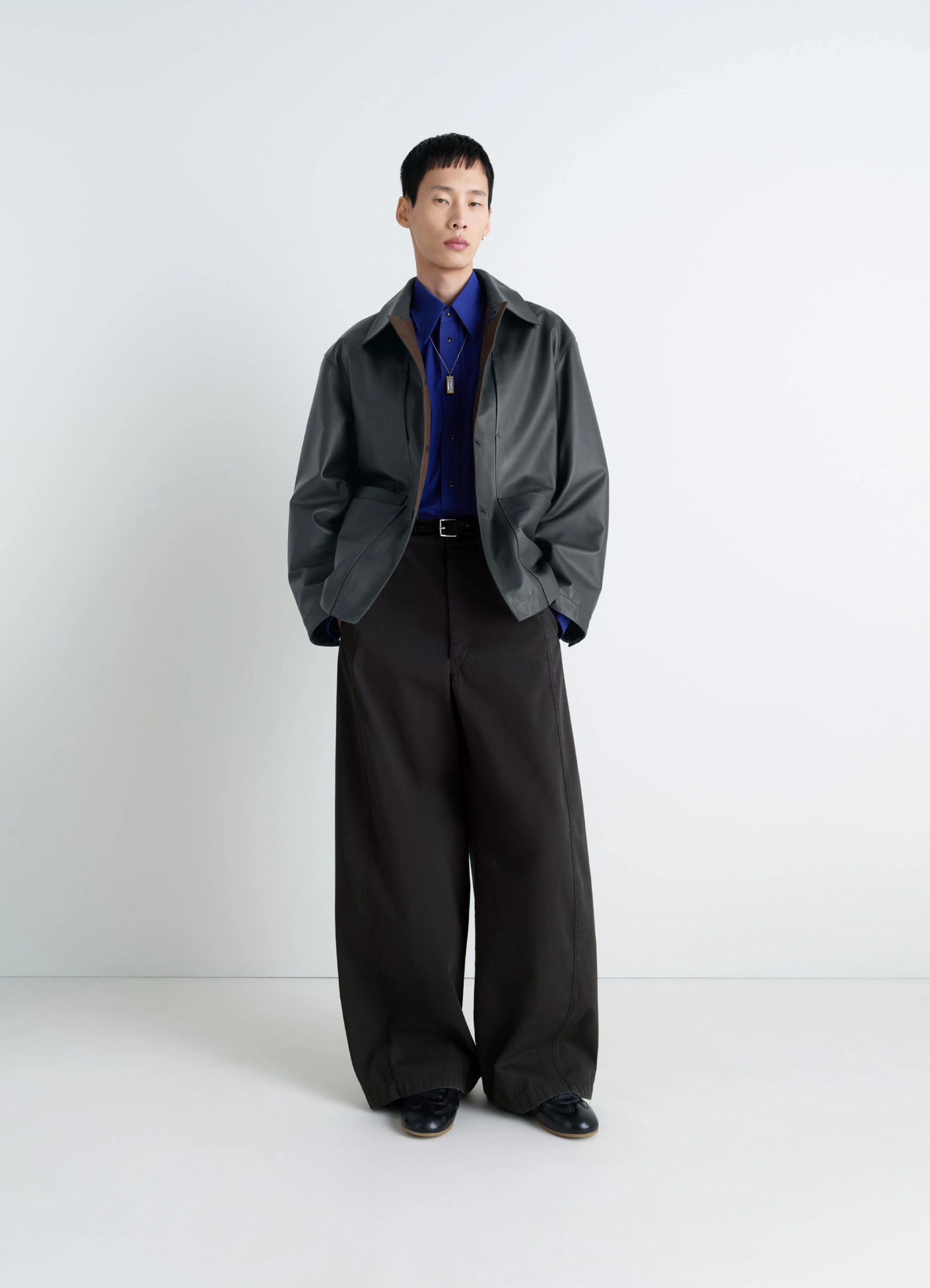 Lemaire leather workwear jacket in thick cow leather, grained, model shot, three-quarter view lightly oversized fit
