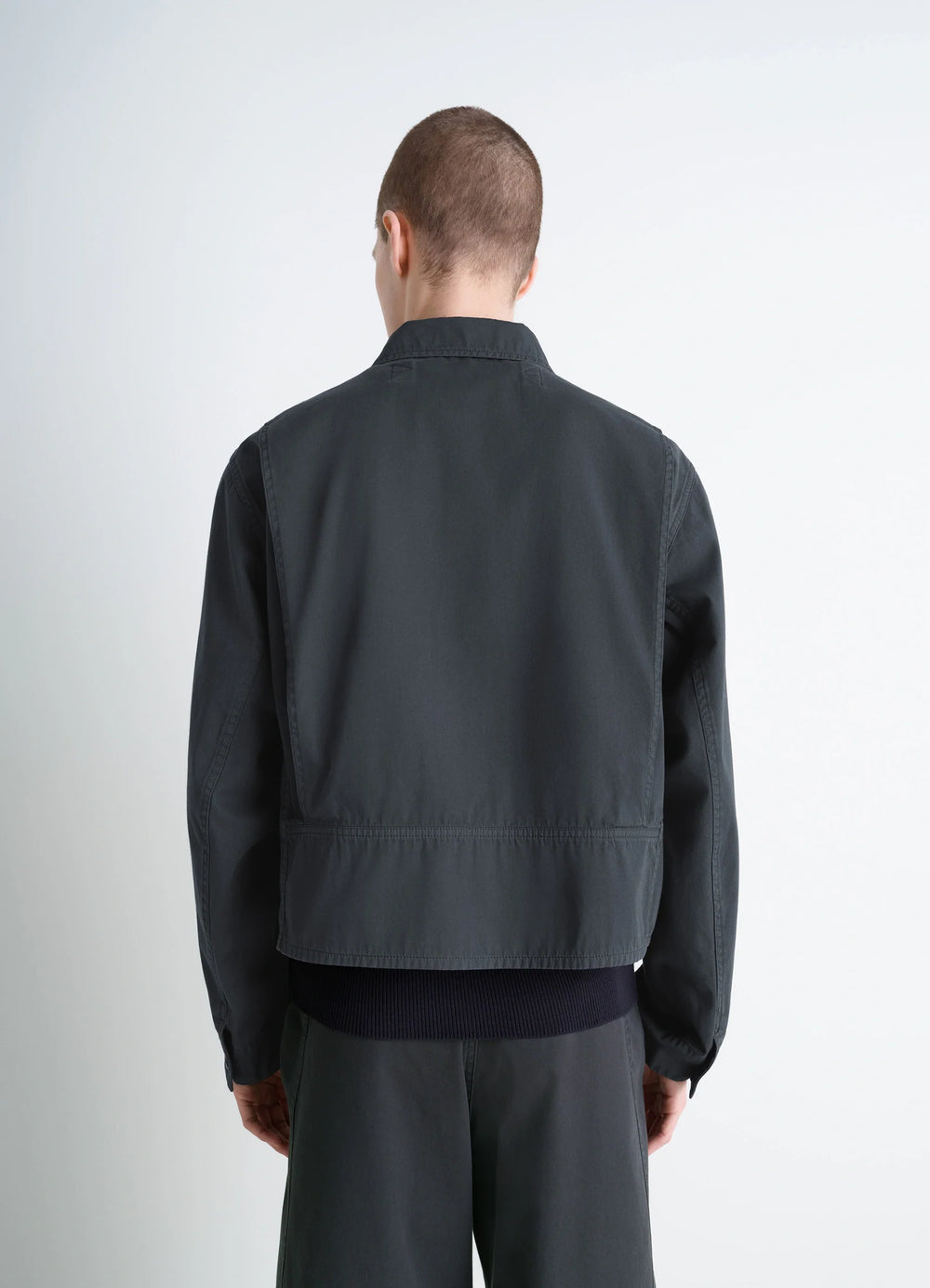 Short Utility Jacket in Dark Cotton Twill, model shot, back view elasticated hem