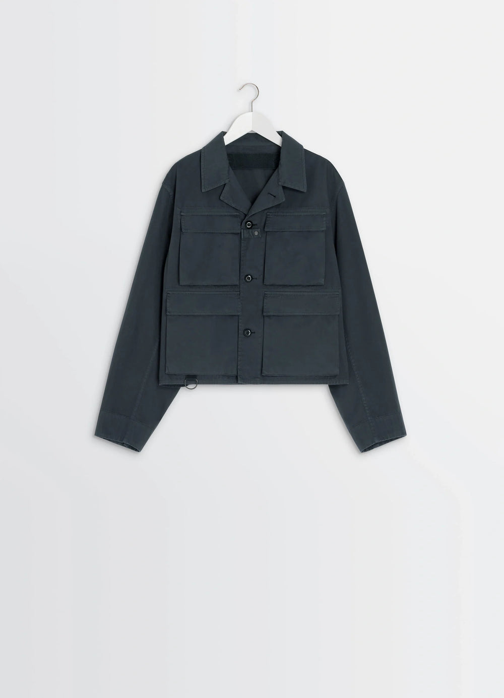 Short Utility Jacket in Dark Cotton Twill, product shot, angled hanging view large flap pockets, straight hem