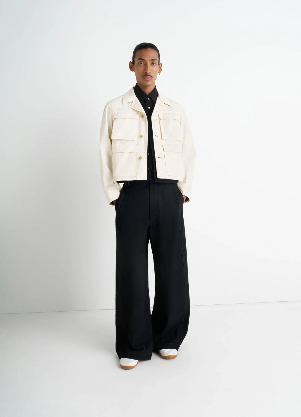 Short Utility Jacket in Compact Cotton Twill, model shot, 3/4 view metal buckles