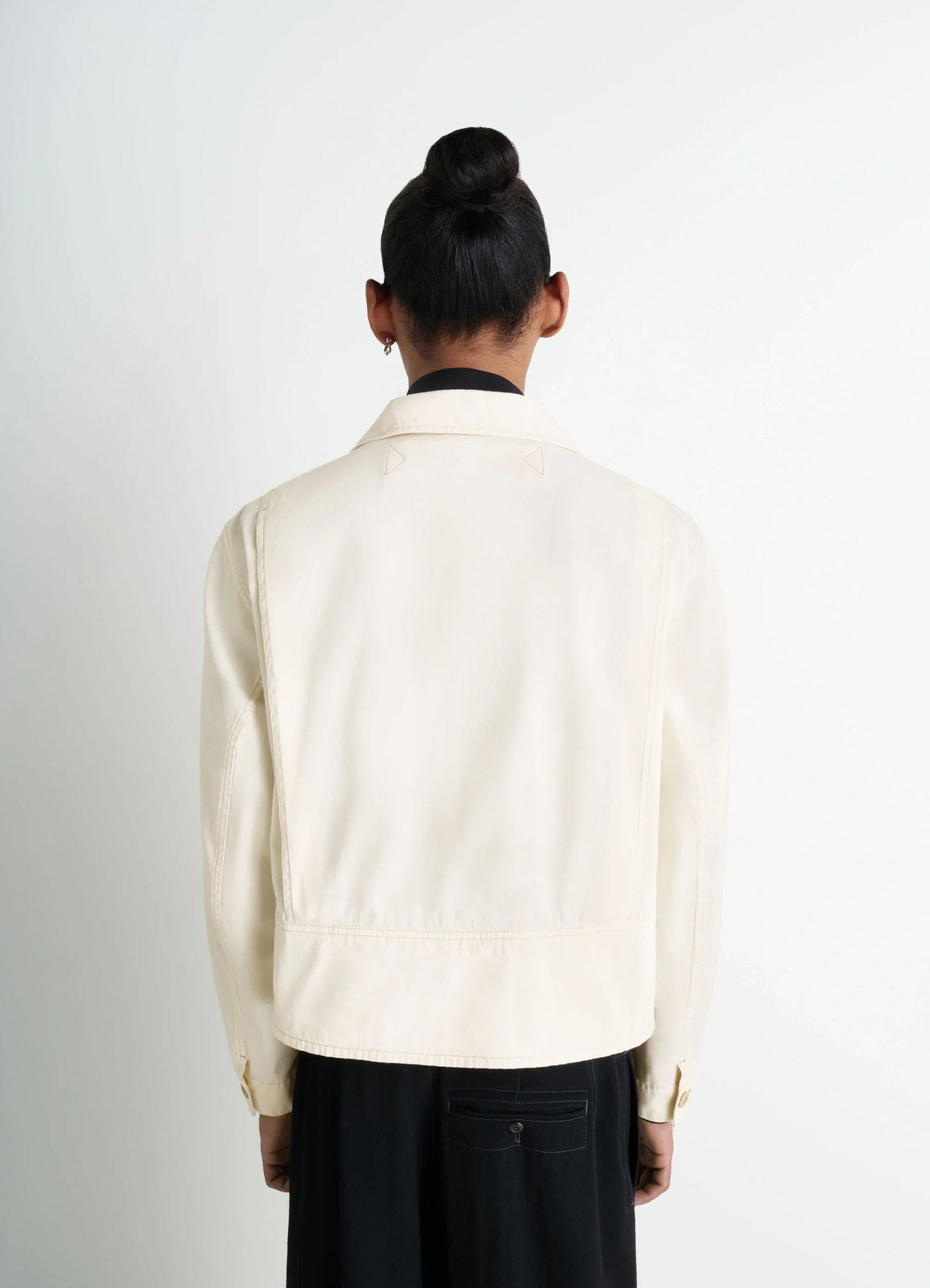 Short utility jacket in compact cotton twill, model shot, back view double-stitched seams
