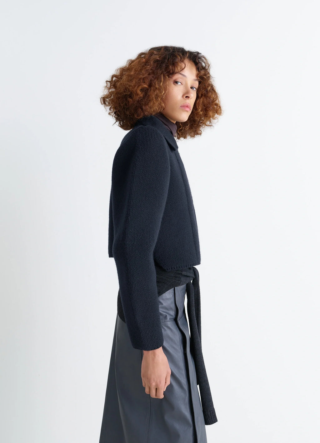 Felted Blouson in Navy Wool Blend, model shot, side view cropped hem