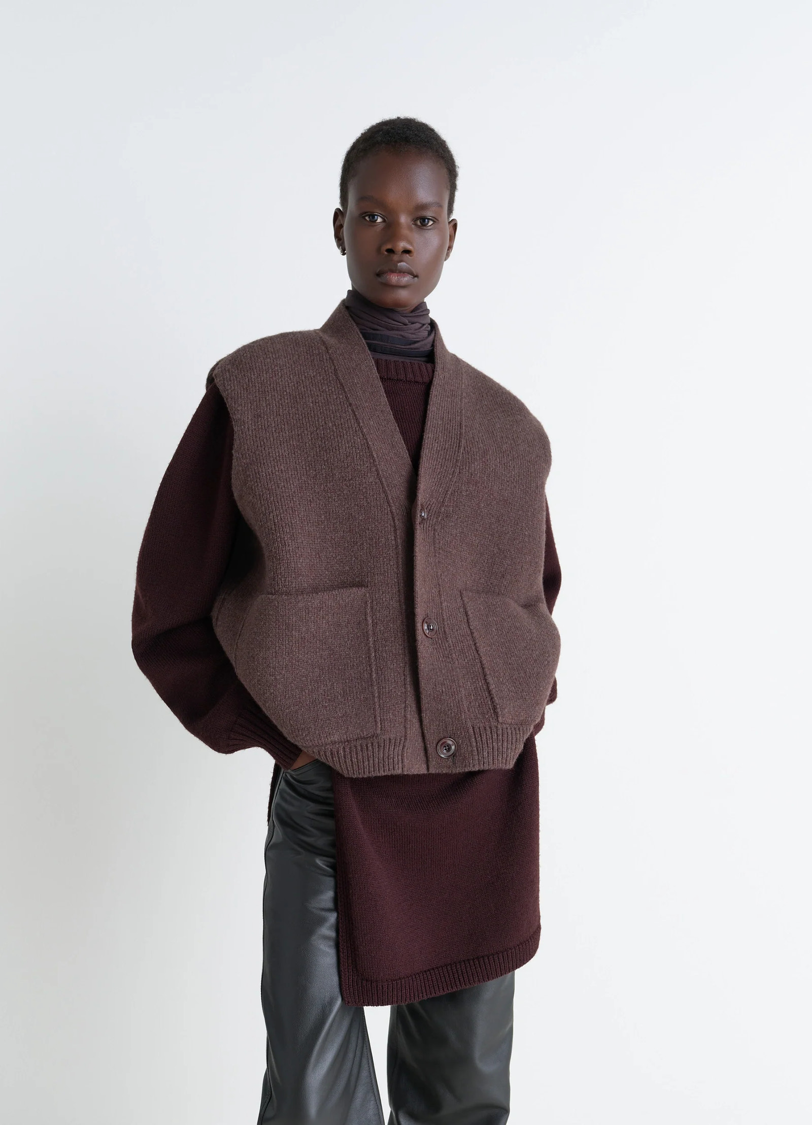 Maxi sleeveless cardigan in wool blend double-faced knit, model shot, front view oversized architectural silhouette