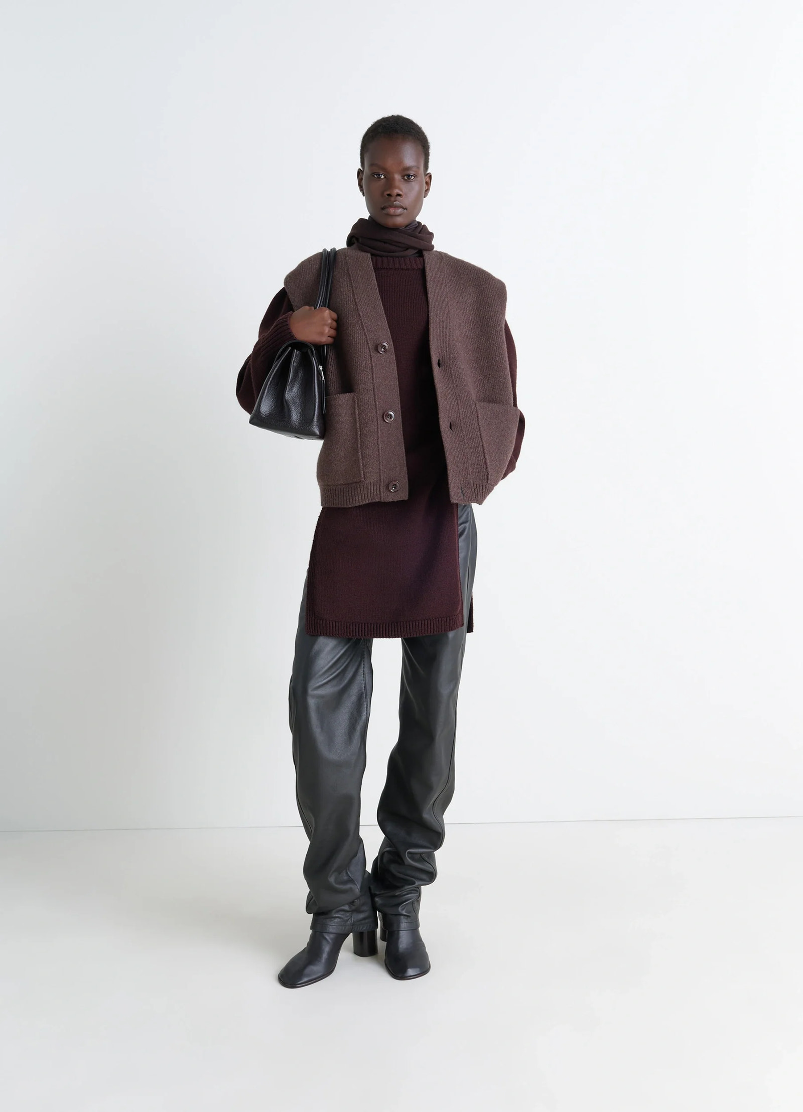 Maxi sleeveless cardigan in wool blend double-faced knit, model shot, side view layered look with pockets