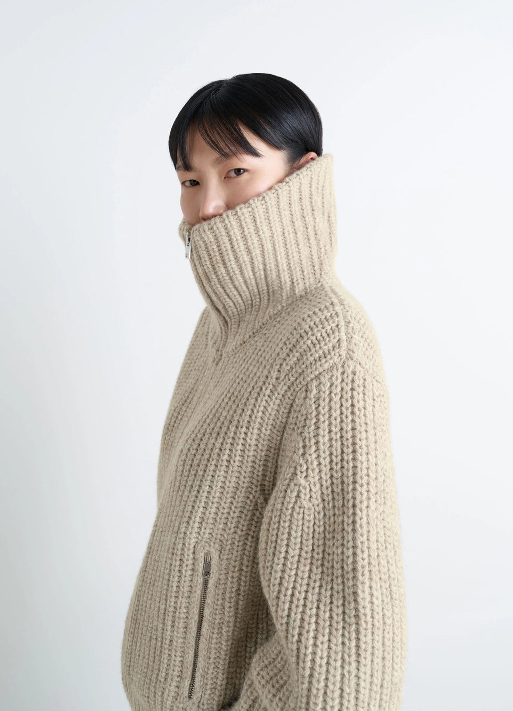 zip-up cardigan with stand-up colla in alpaca and yak wool knit, model shot, side view high collar zipped up