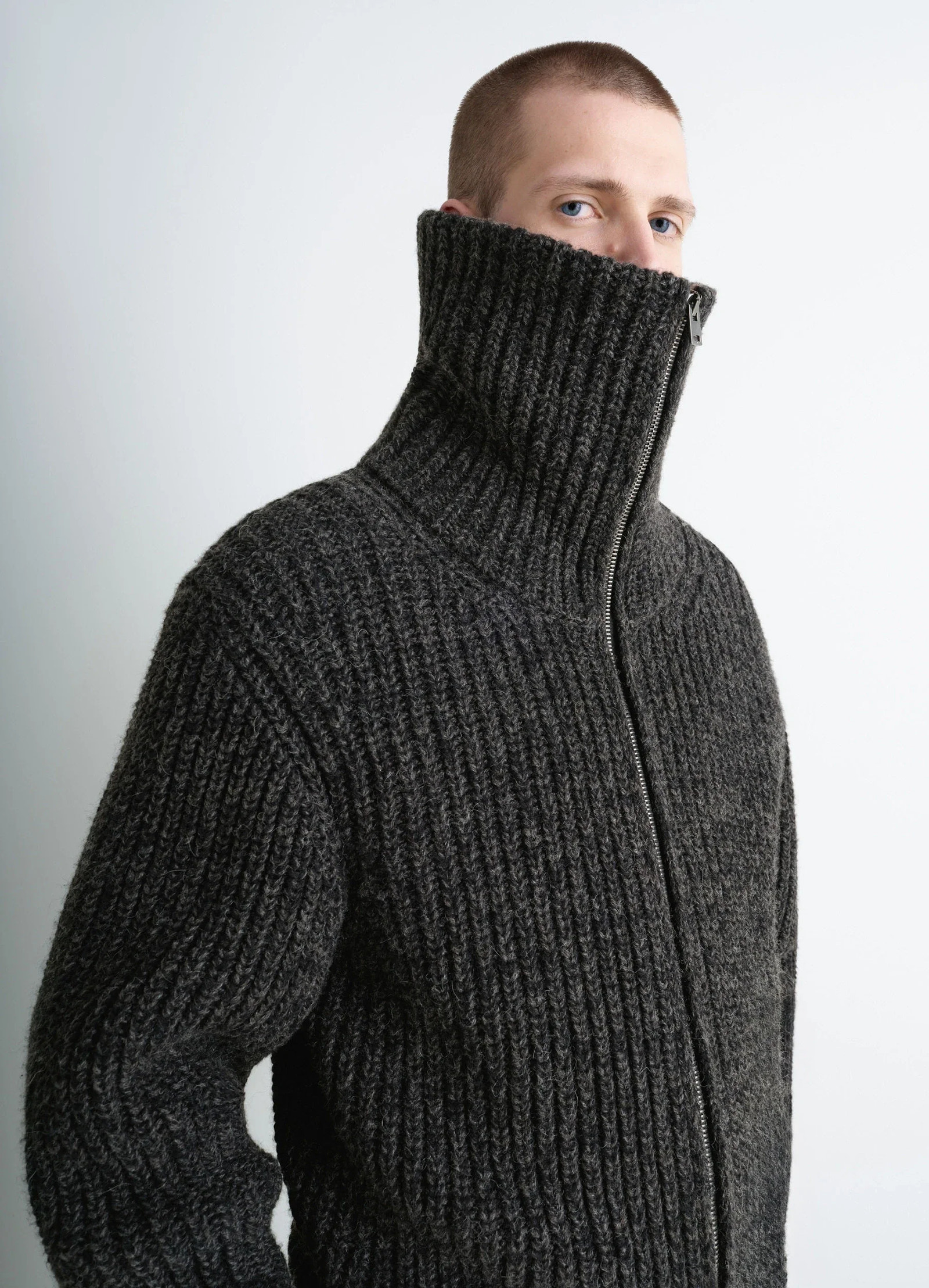 Crafted zip-up cardigan in heather alpaca yak wool, model shot, three-quarter view high collar zipped up