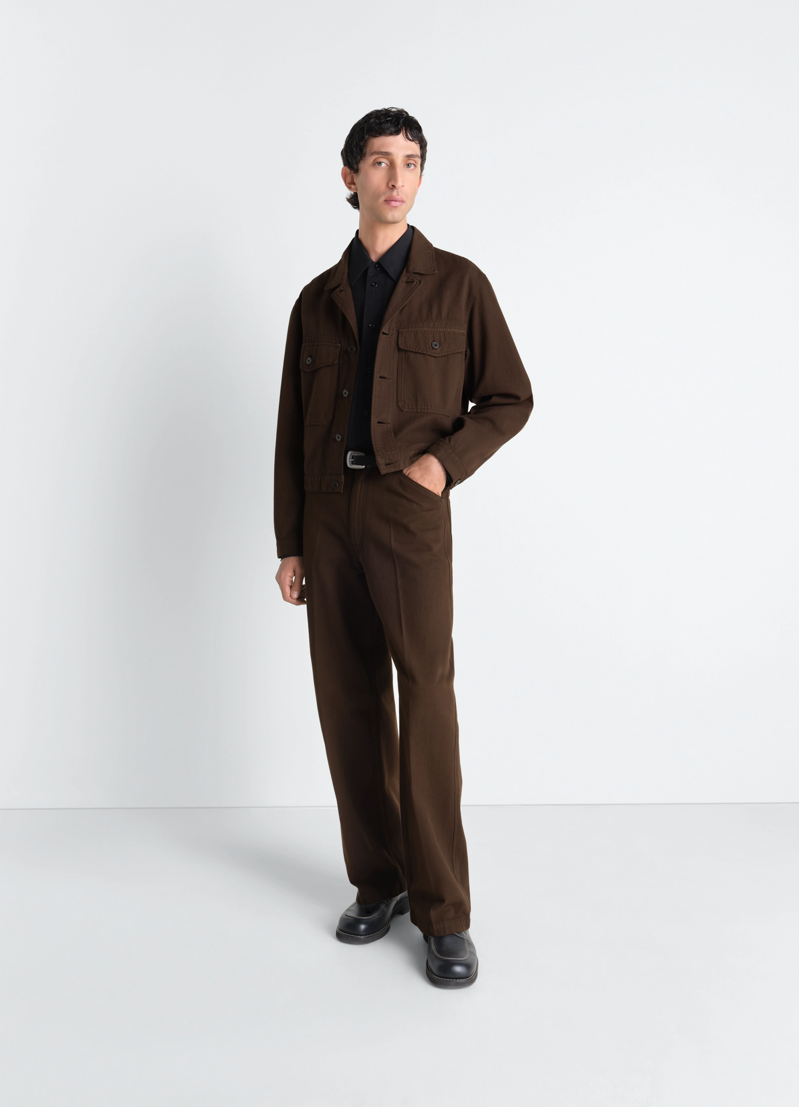 Trucker jacket in dyed broken twill in dyed broken twill, model shot, 3/4 side view buttoned chest pockets