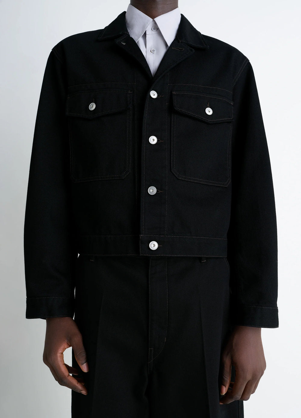 Lemaire Trucker Jacket in Deep Black Thick Denim, model shot, close-up chest view visible chest pockets