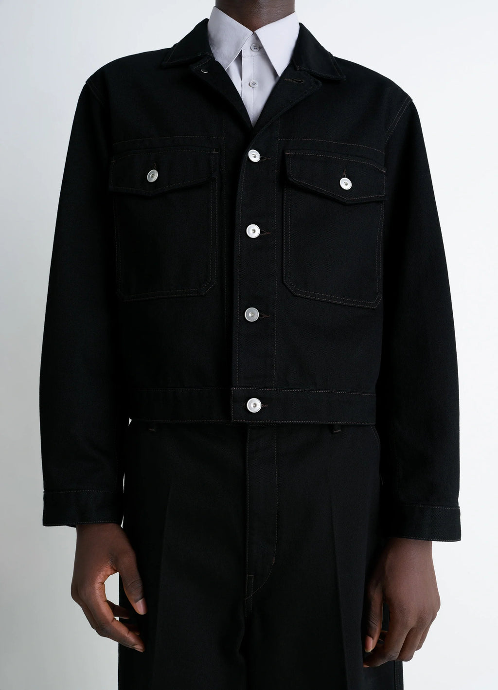 Lemaire Trucker Jacket in Deep Black Thick Denim, model shot, close-up chest view visible chest pockets