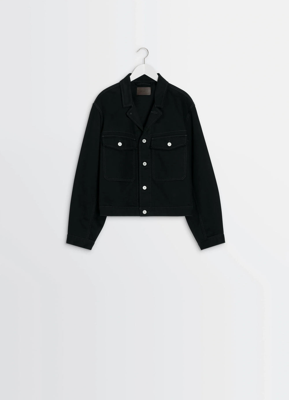 Lemaire Trucker Jacket in Deep Black Thick Denim, product shot, hanger front view contrast stitching detail
