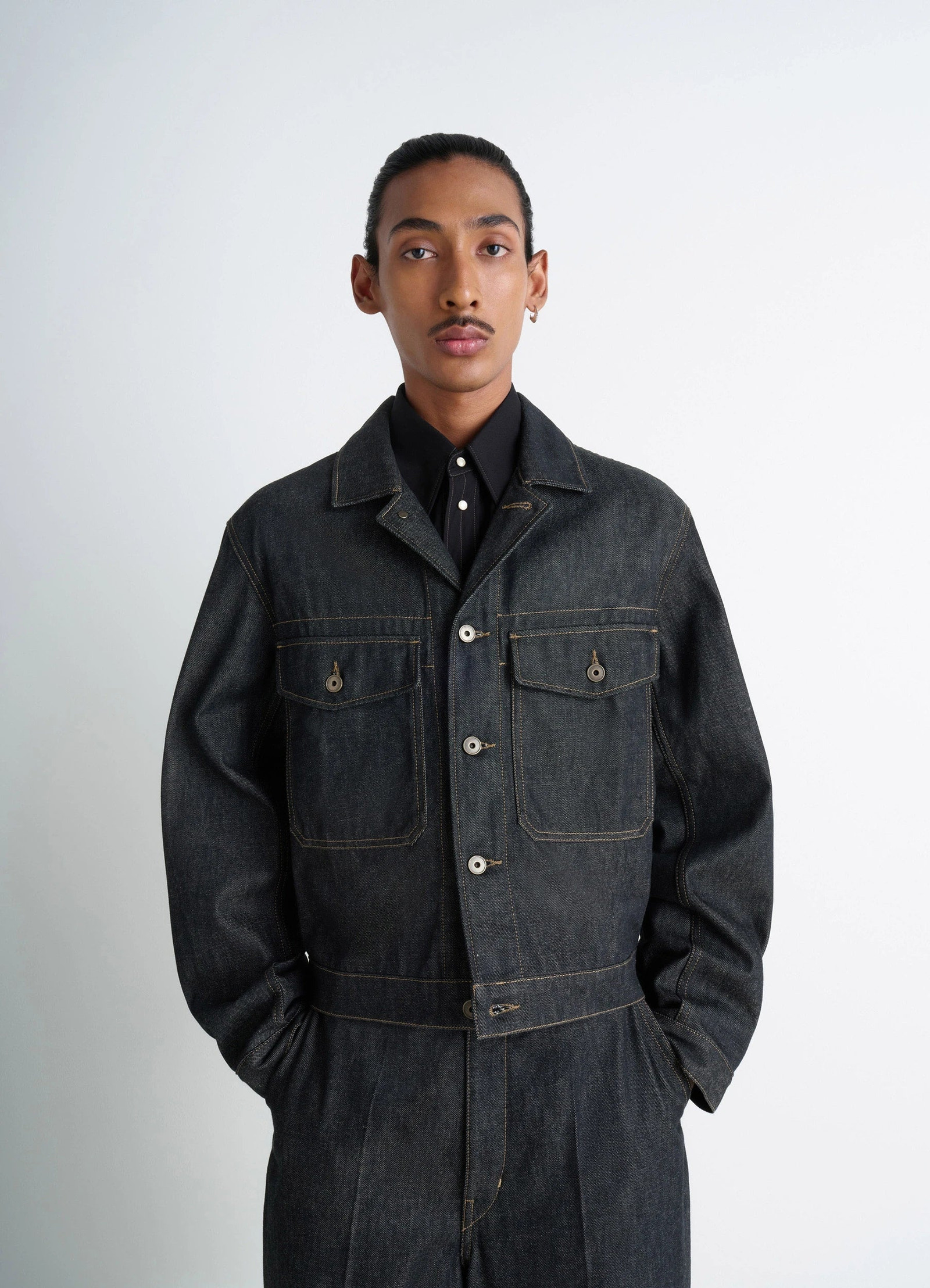 Lemaire trucker jacket in slate denim, model shot, front view boxy fit with pockets