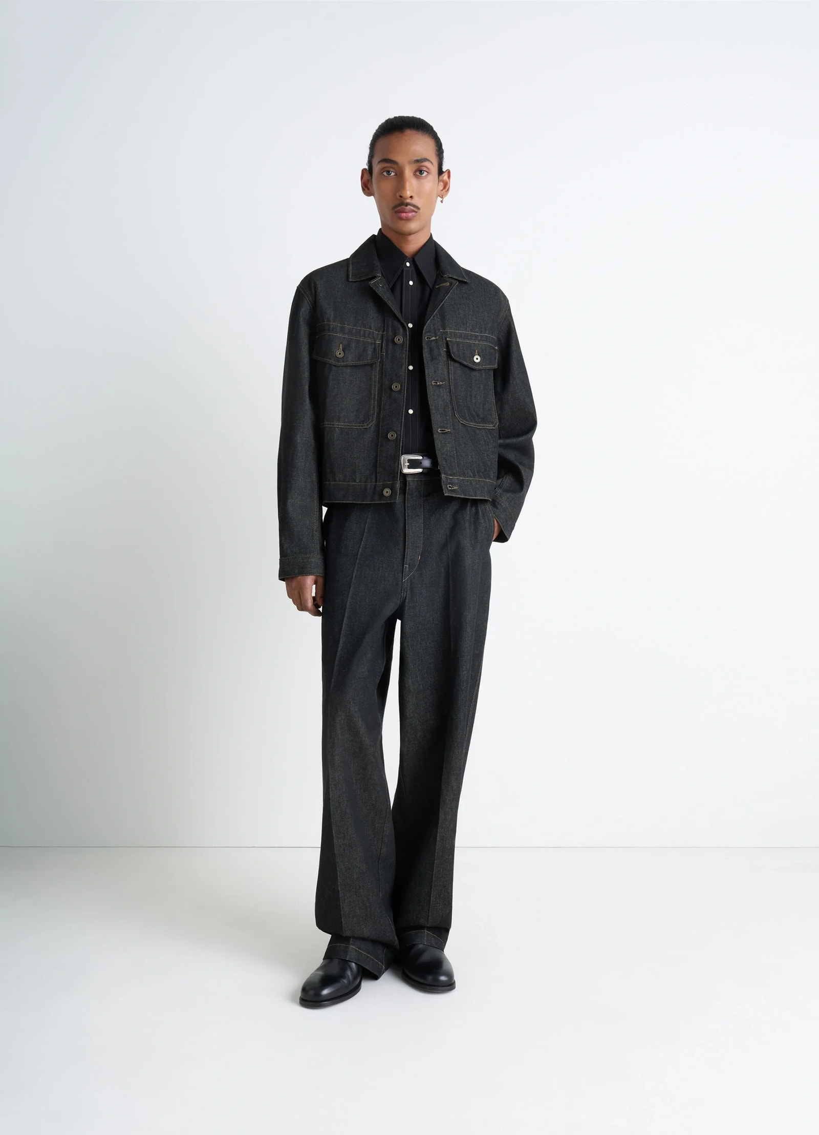 Lemaire trucker jacket in slate denim, model shot, three-quarter view button-up with collar