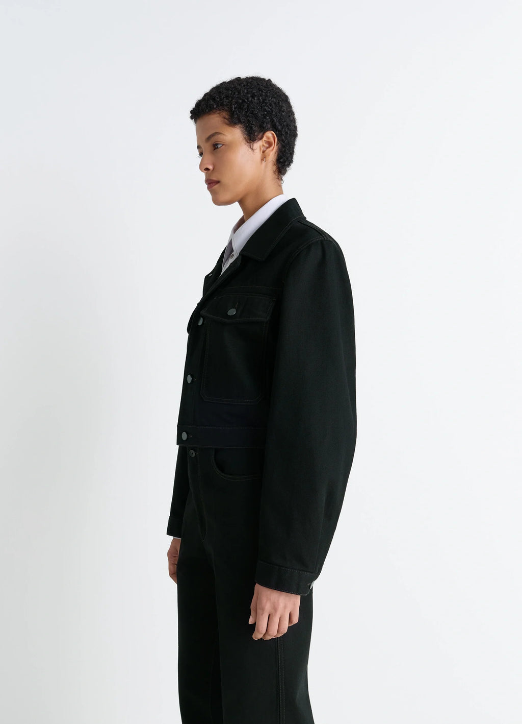 Lemaire Cropped Blouson in Deep Black Thick Denim, model shot, side view buttoned cuffs