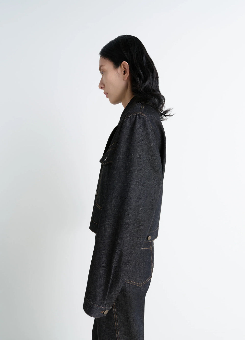 Lemaire Cropped Blouson in Yarn-Dyed Slate Denim, model shot, side profile view extended sleeve detail