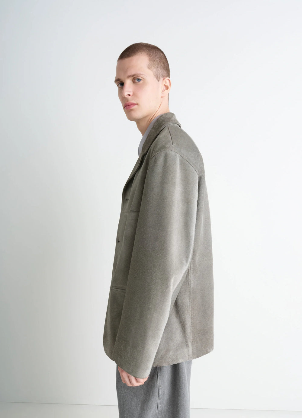 Suede Single Breasted Jacket in Brushed Suede Cow Leather, model shot, side profile view relaxed fit, clean lines