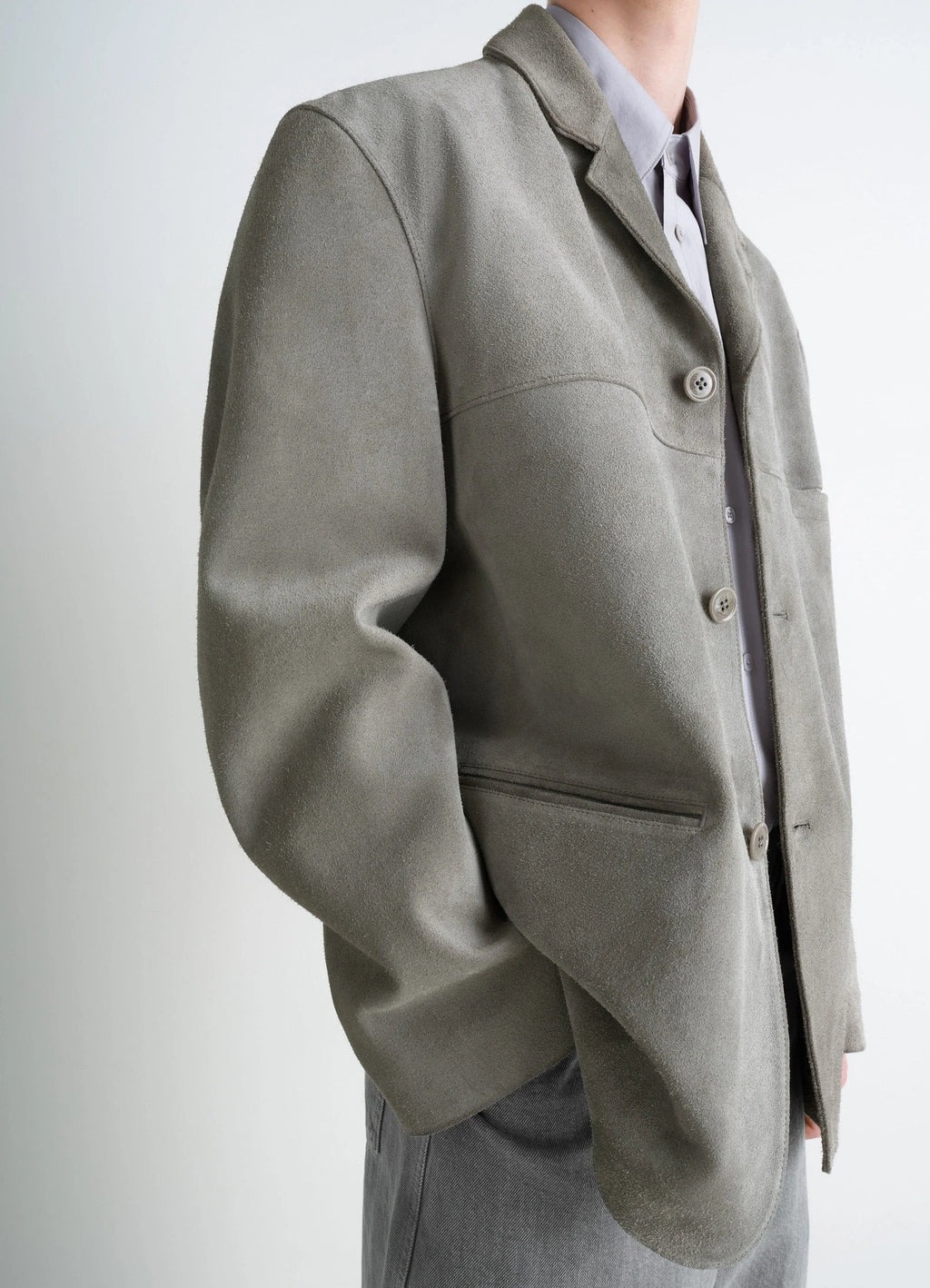 Suede Single Breasted Jacket in Brushed Suede Cow Leather, model shot, over-the-shoulder view oversized fit