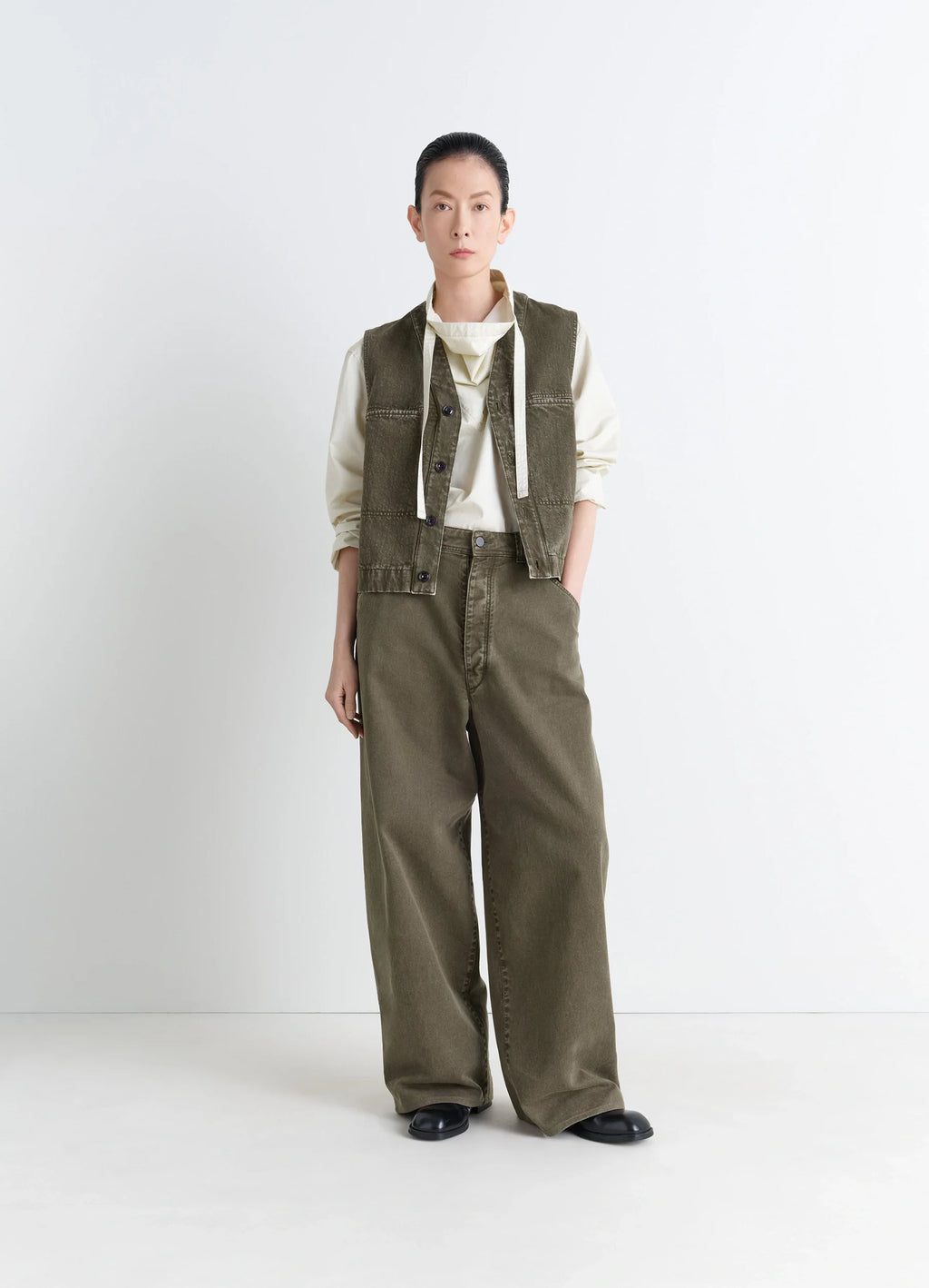 Lemaire Pocket Gilet in Garment Dyed Snow Thick Denim, model shot, side view loose fit