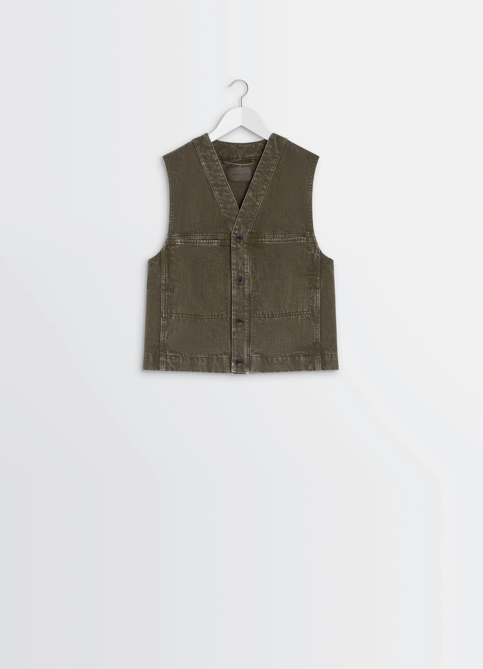 Lemaire pocket gilet in garment dyed snow thick denim, product shot, angled overhead view structured fit