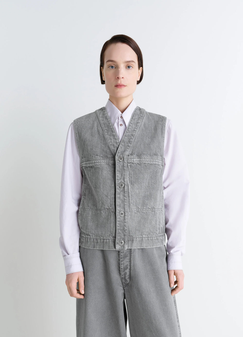 Lemaire Pocket Gilet in Garment Dyed Snow Denim, model shot, front view utilitarian aesthetic