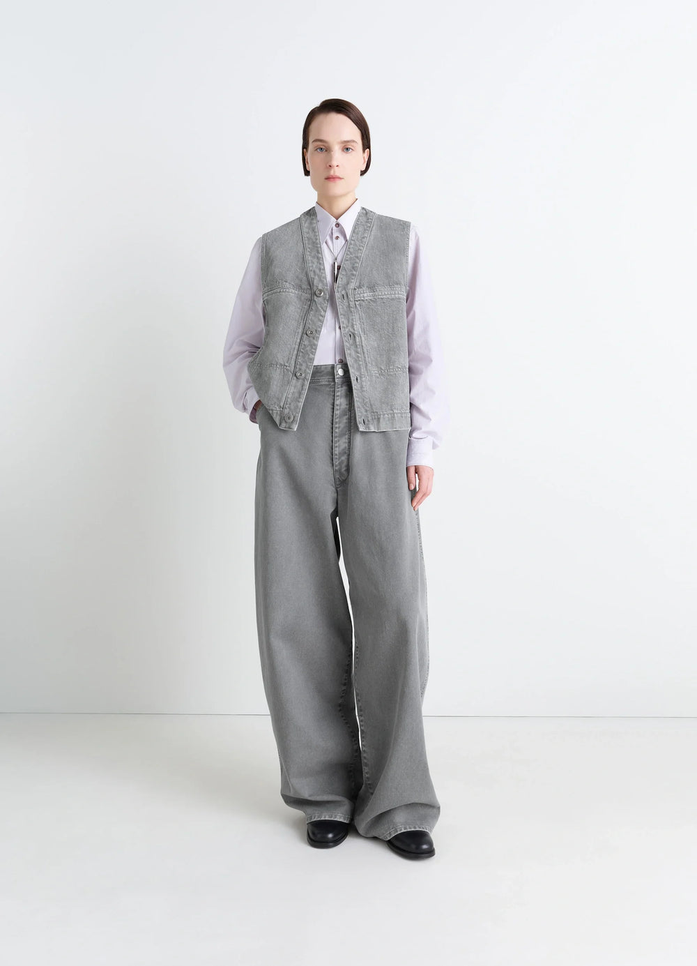 Lemaire Pocket Gilet in Garment Dyed Snow Denim, model shot, three-quarter view relaxed fit structure