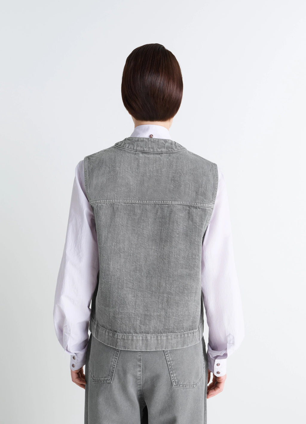 Lemaire Pocket Gilet in Garment Dyed Snow Denim, model shot, back view minimalist back design