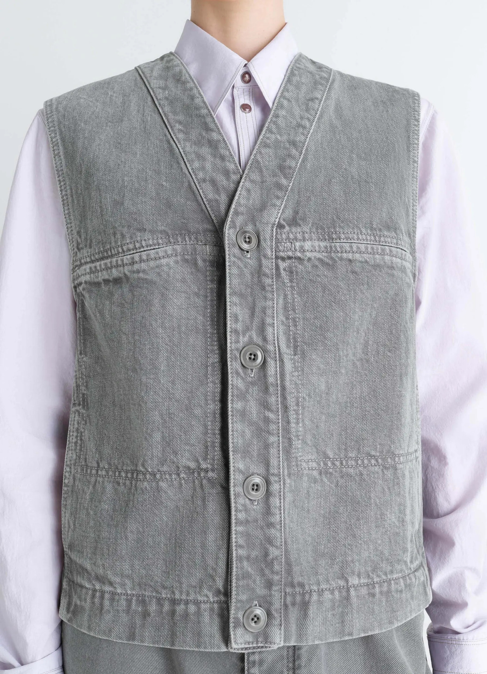 Lemaire pocket gilet in garment dyed snow denim, model shot, close-up front collared shirt pairing