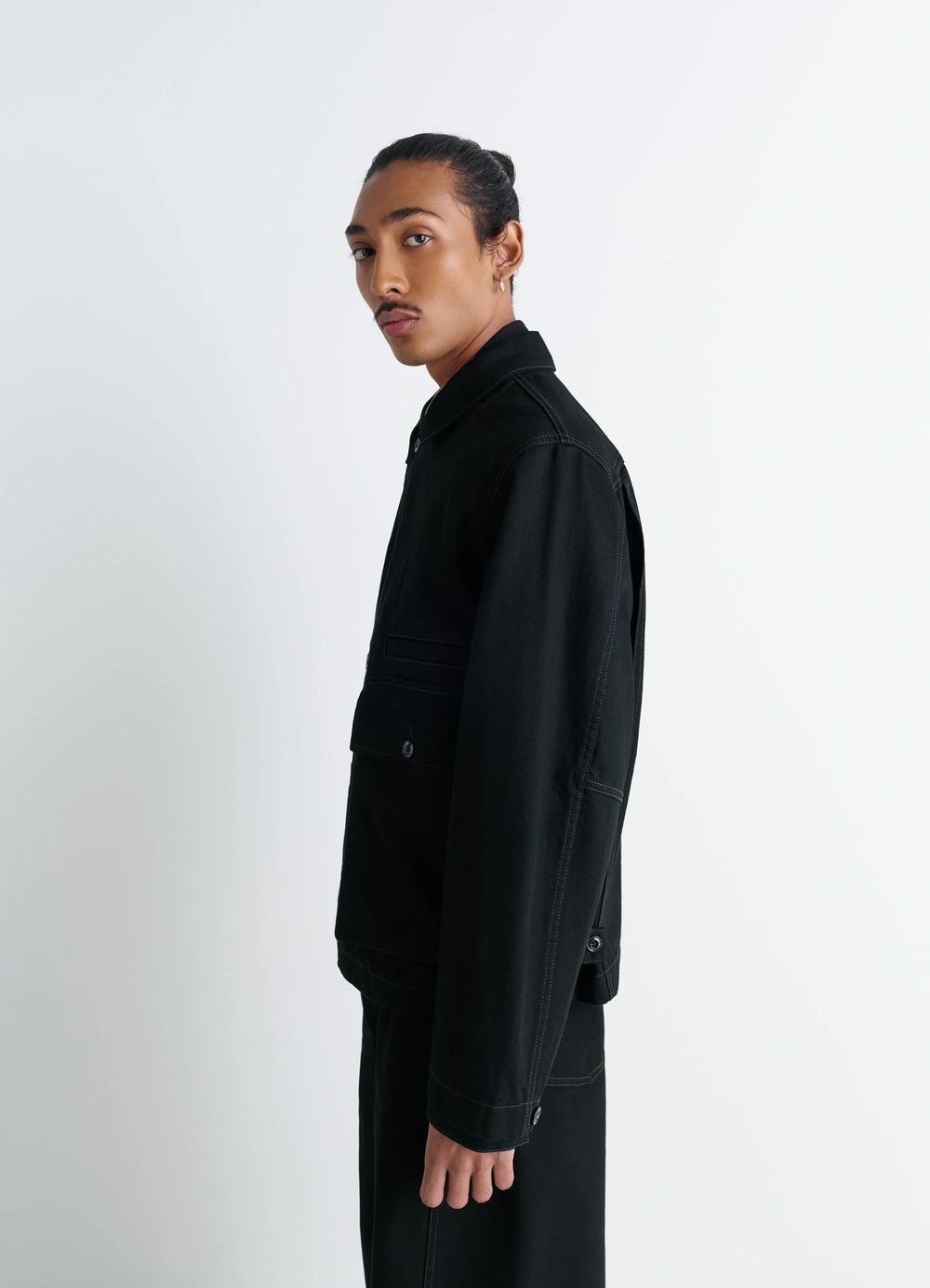 Lemaire Boxy Jacket in Heavy Black Denim, model shot, side profile view sleek shoulder design