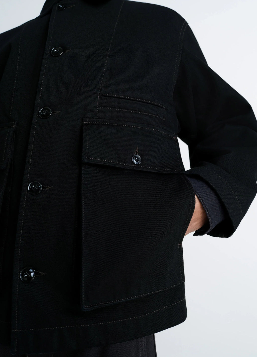 Lemaire Boxy Jacket in Heavy Black Denim, model shot, close-up view visible button details