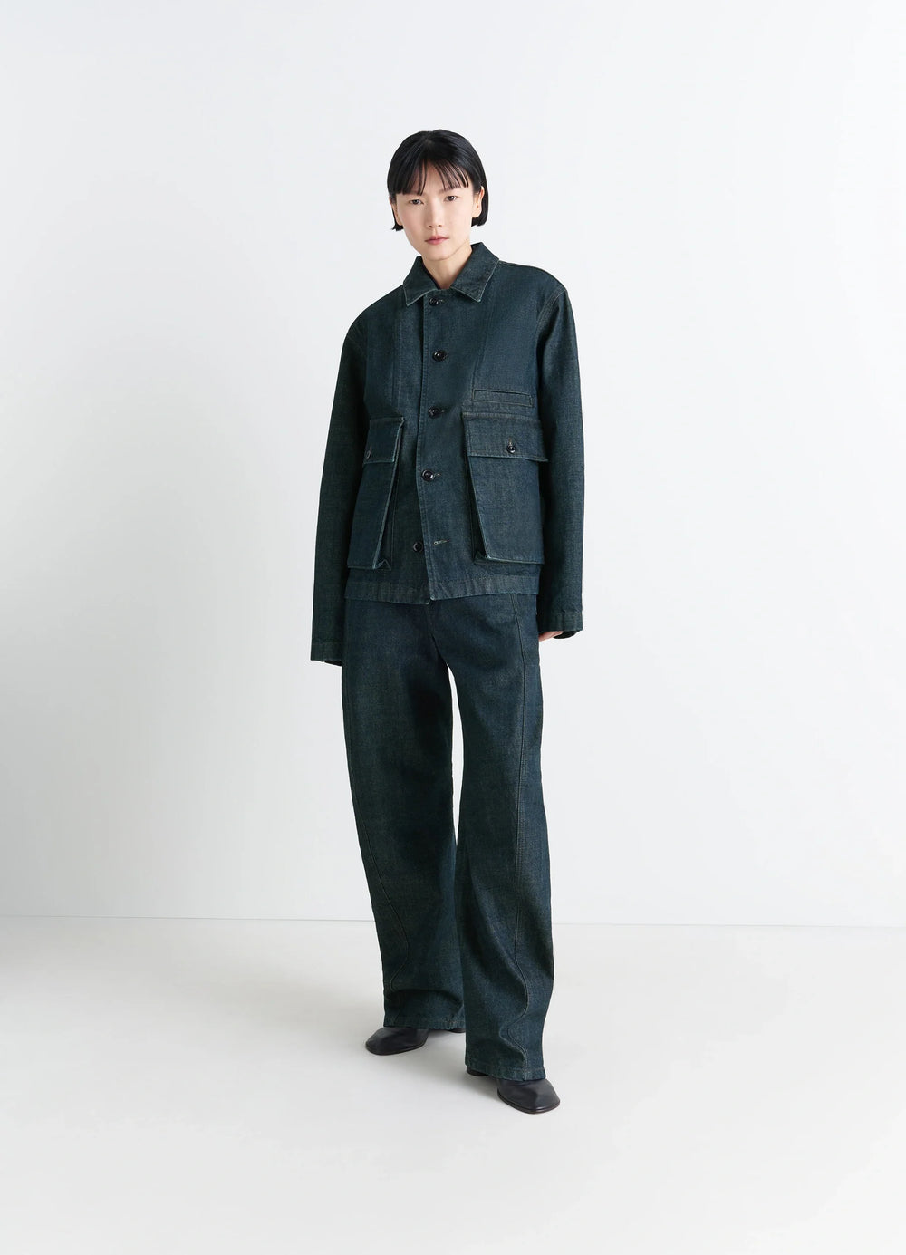 Lemaire Boxy Jacket in Deep Indigo Denim, model shot, three-quarter view large flap pockets