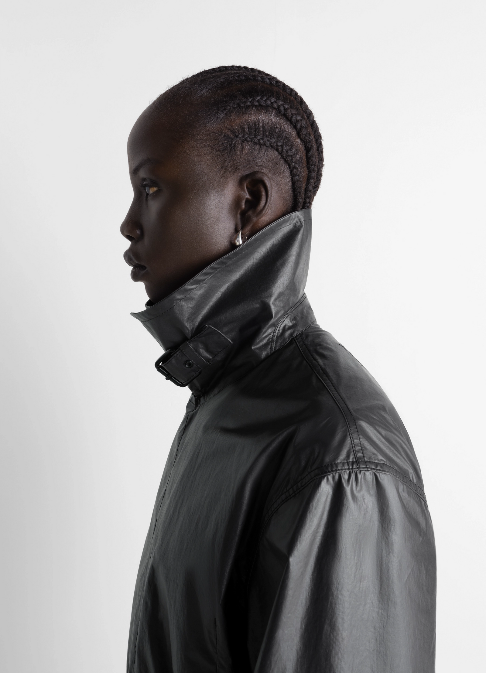 Light wrap jacket in light coated cotton, model shot, side view high collar detail