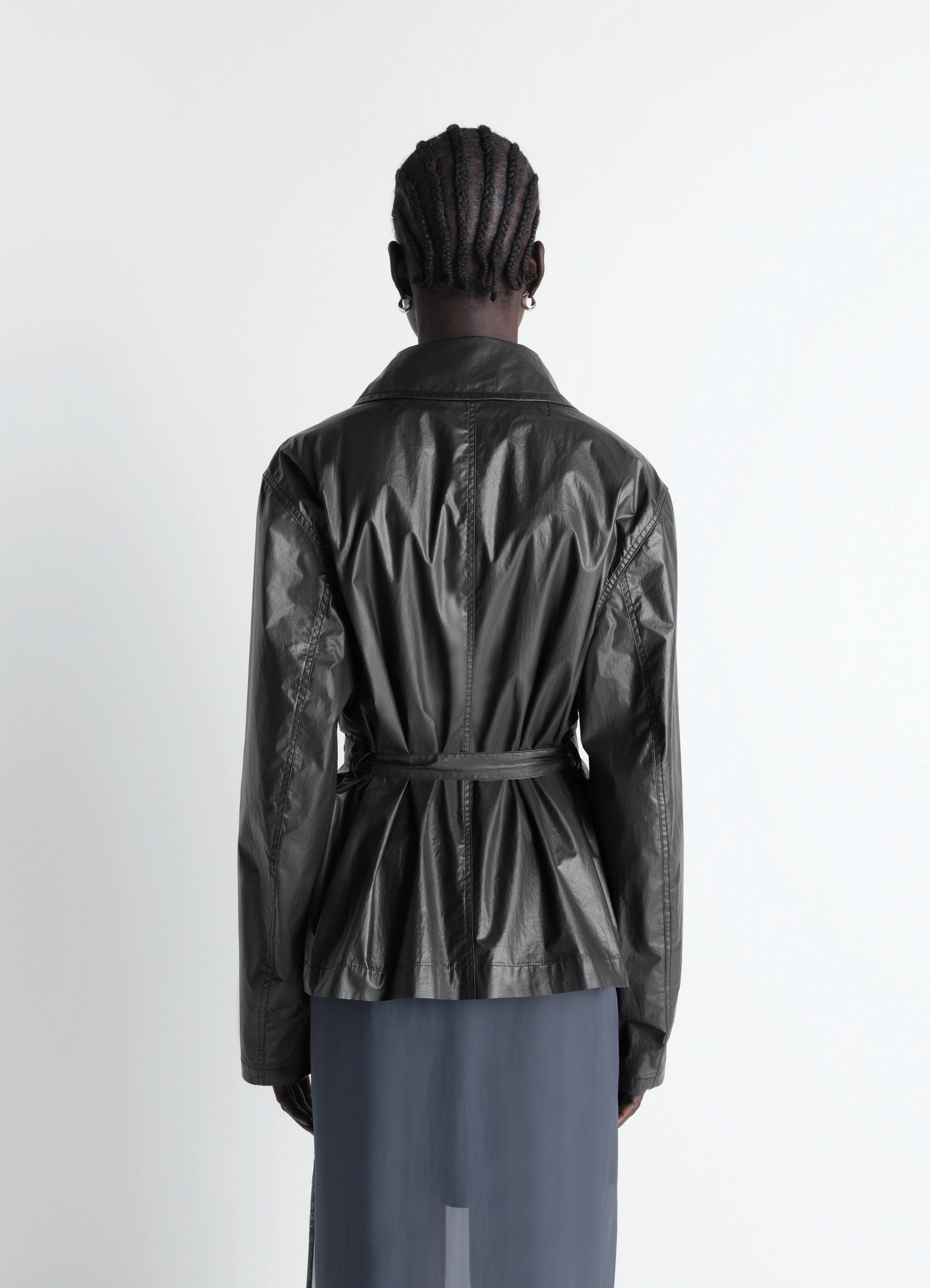 Light wrap jacket in light coated cotton, model shot, back view belted pleated waist