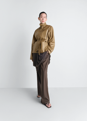 Light wrap jacket in light coated cotton, model shot, front view belted high waist