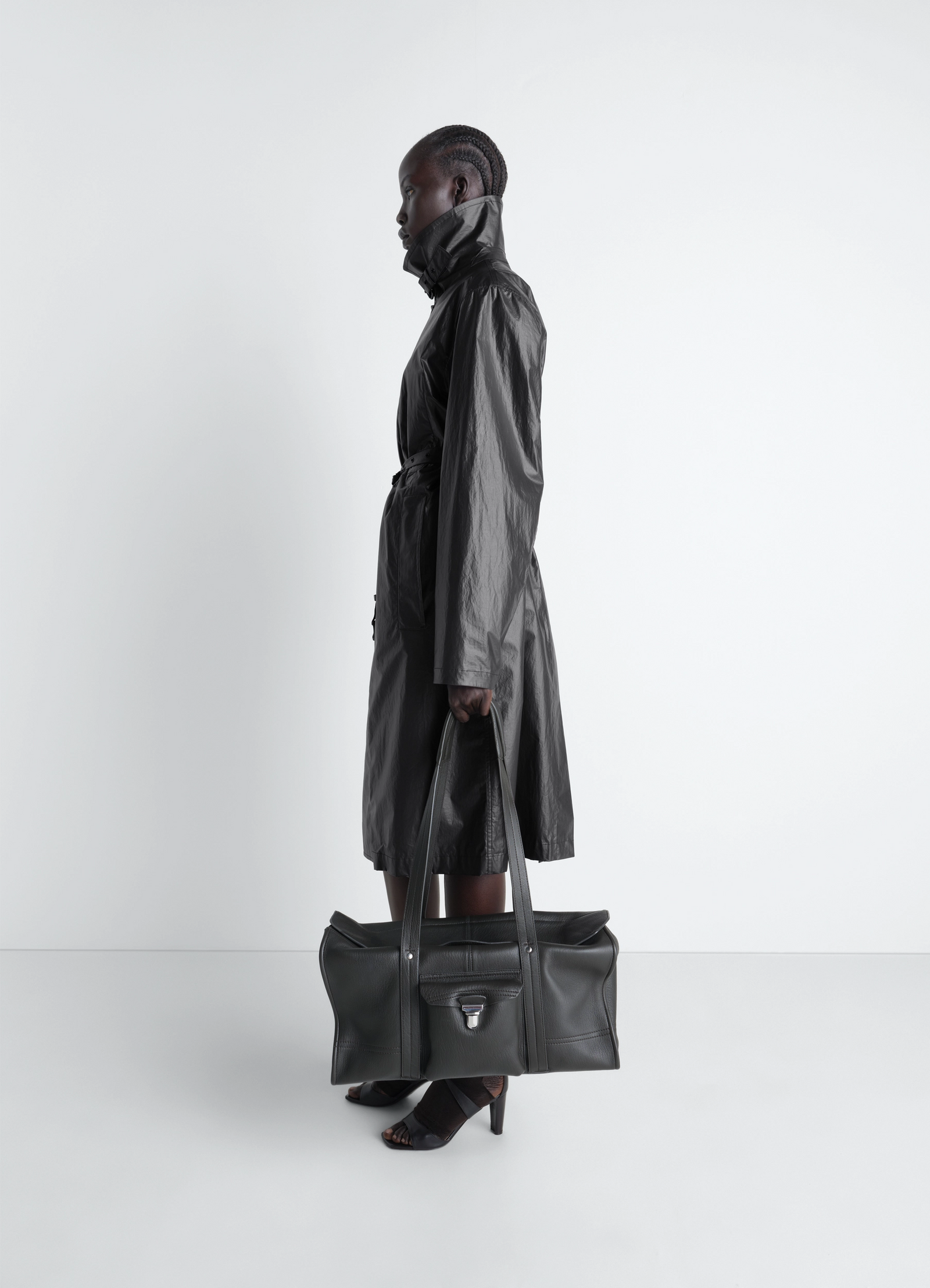 Light wrap coat in light coated cotton, model shot, side profile view longline with extended collar