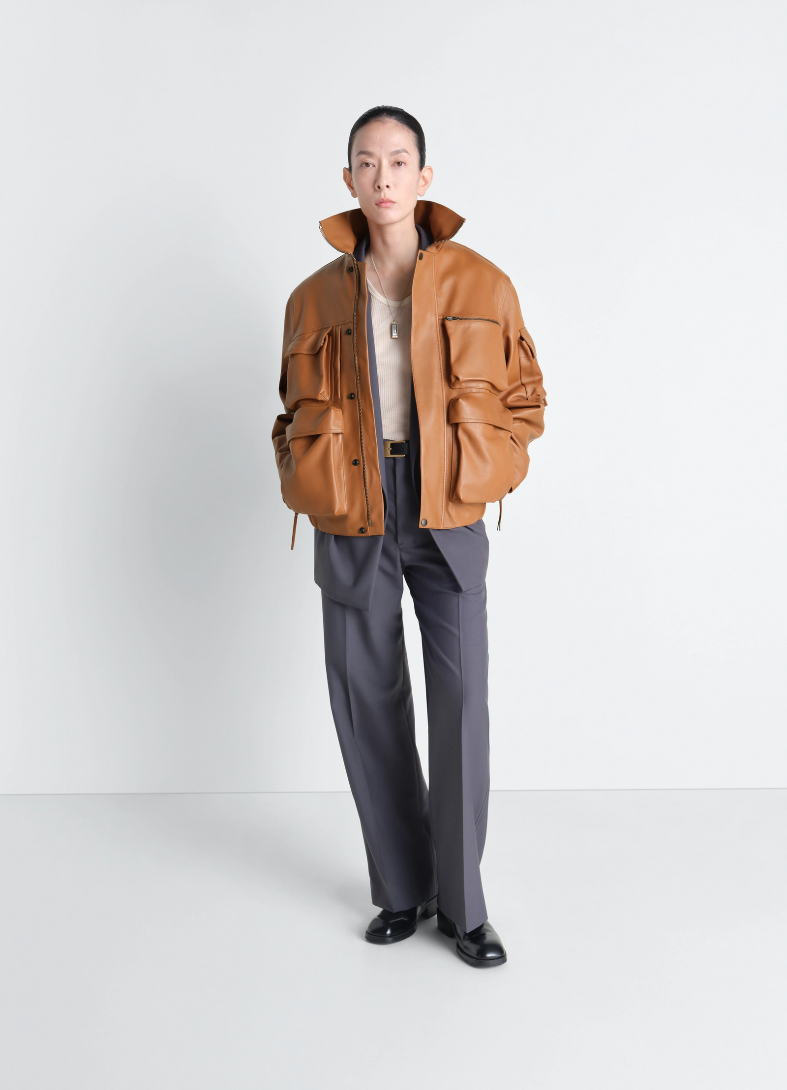Lemaire leather blouson in cowhide leather, model shot, full body porte view oversized fit with high collar