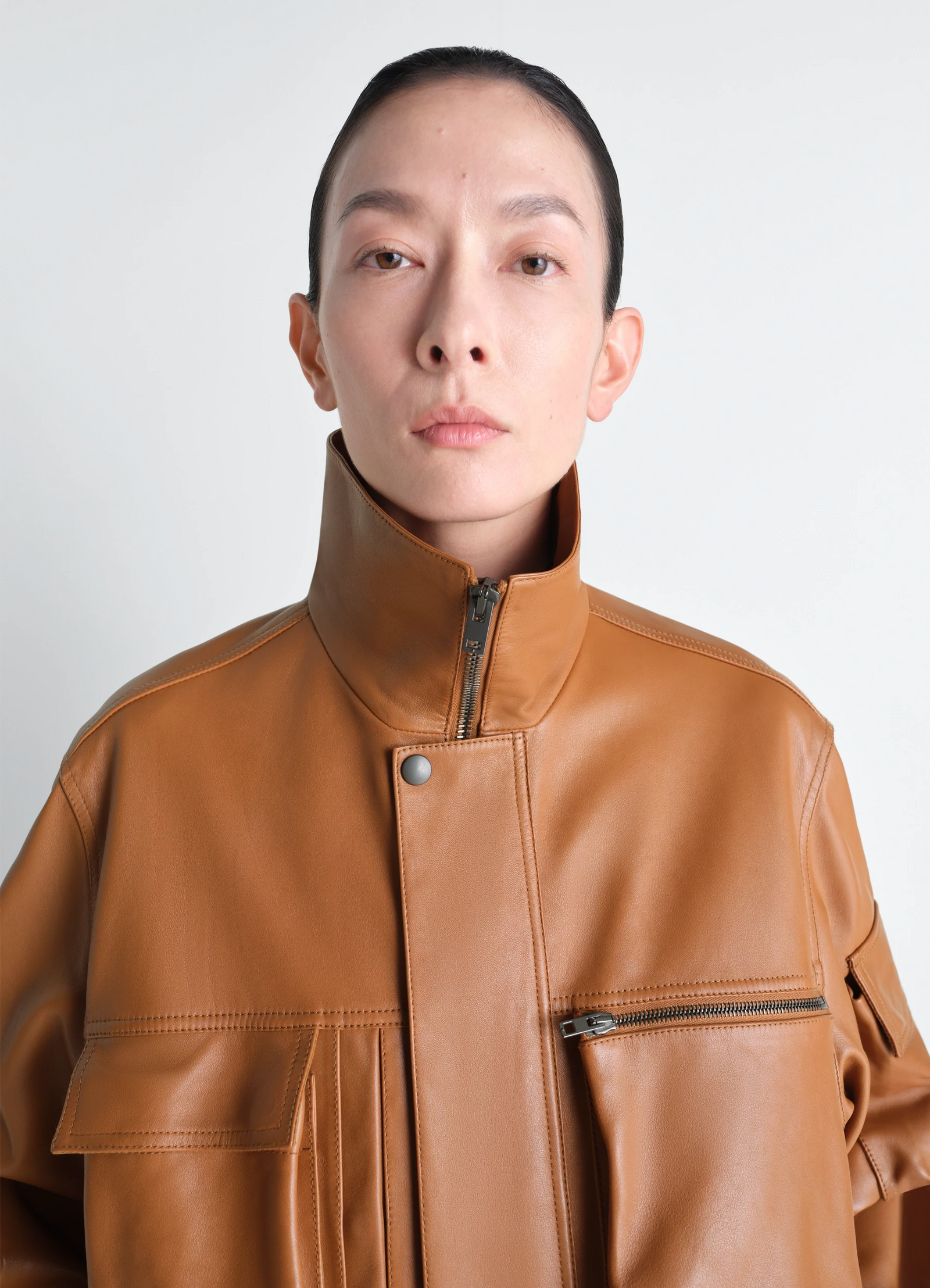 Lemaire leather blouson in cowhide leather, model shot, close-up front high collar detail
