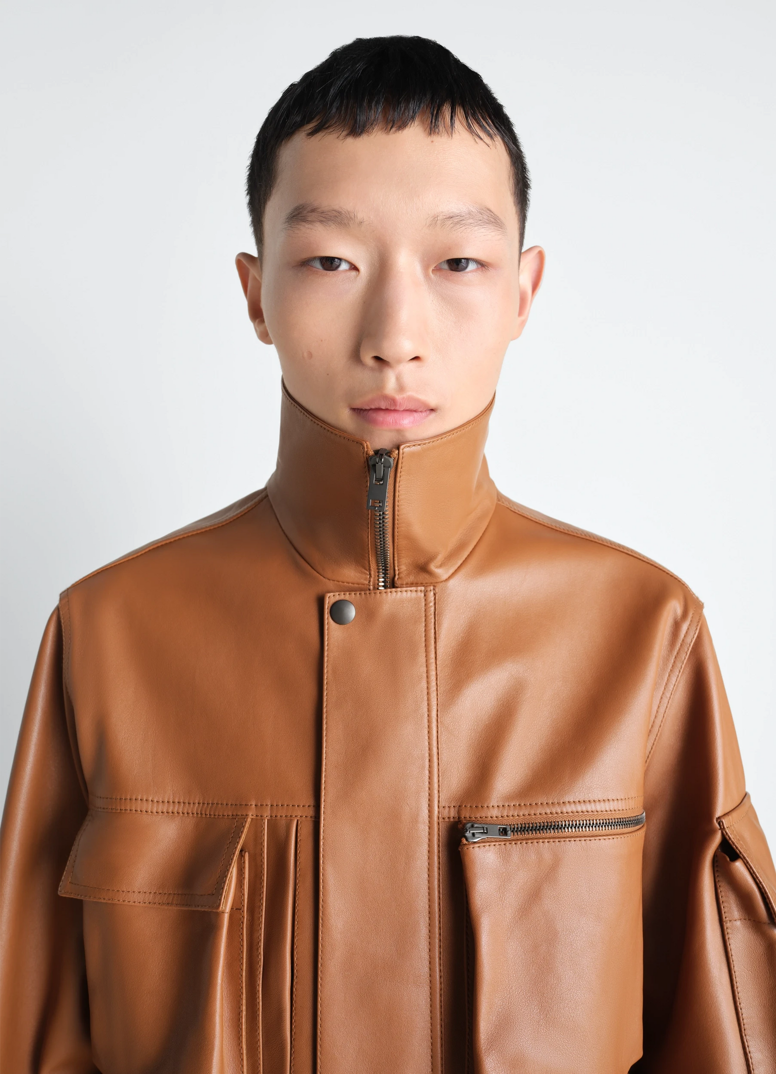 Lemaire leather blouson in cowhide leather, model shot, close-up portrait front pocket detail