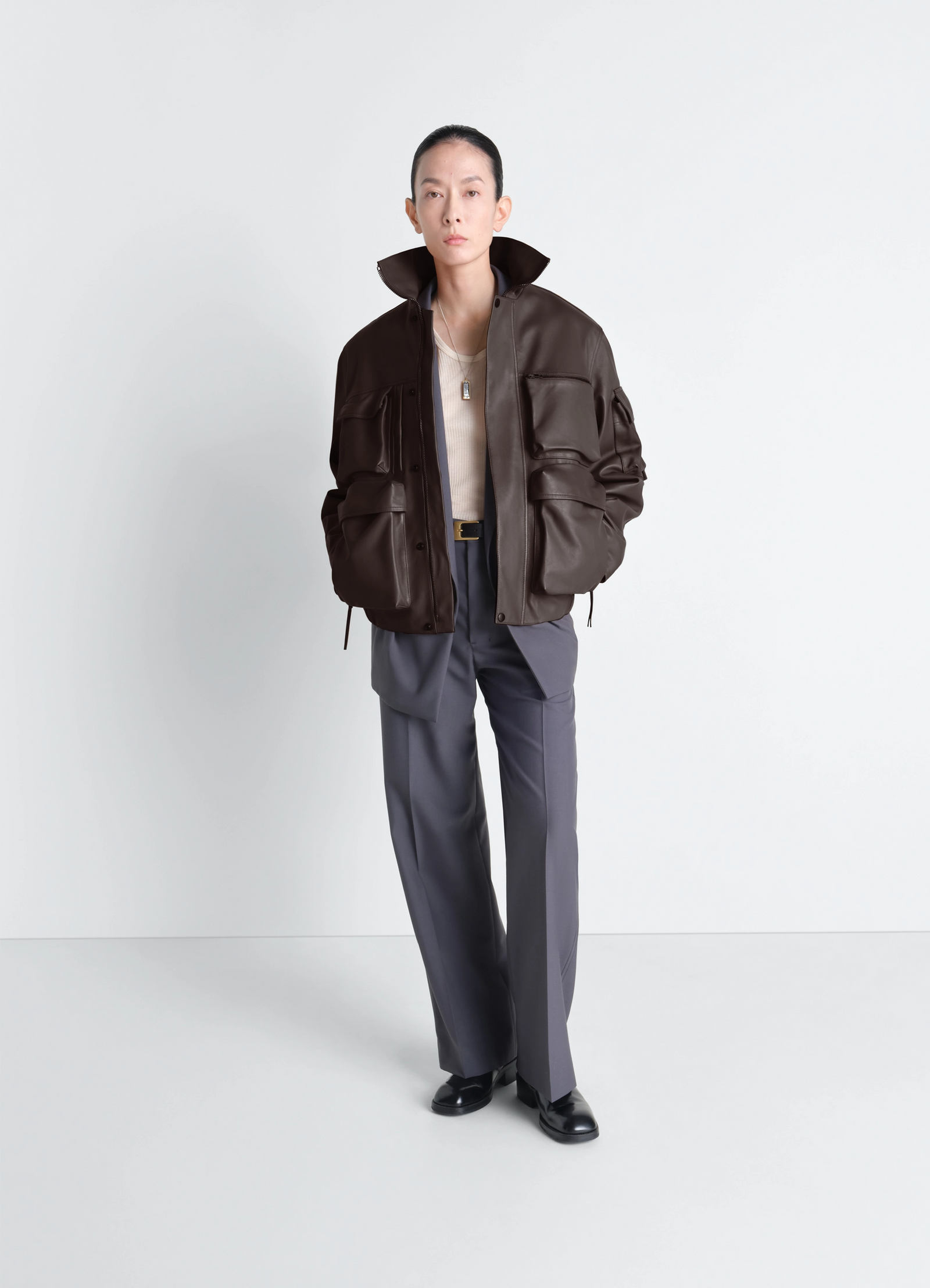 Lemaire leather blouson in cowhide leather, model shot, three-quarter view high collar worn open