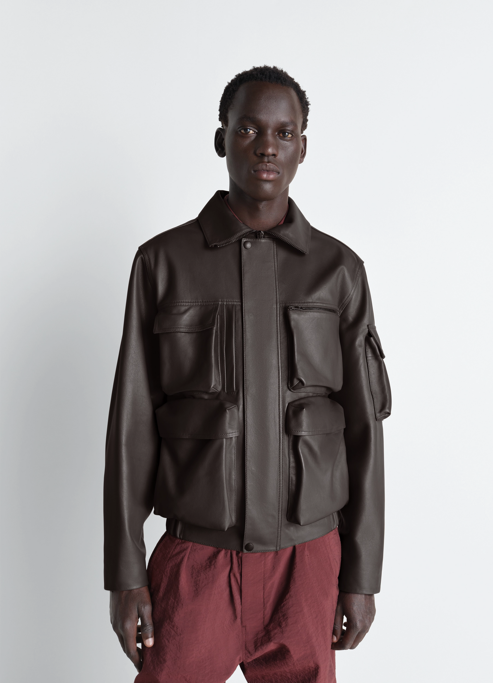 Lemaire leather blouson in cowhide leather, model shot, front view multi-pocket design