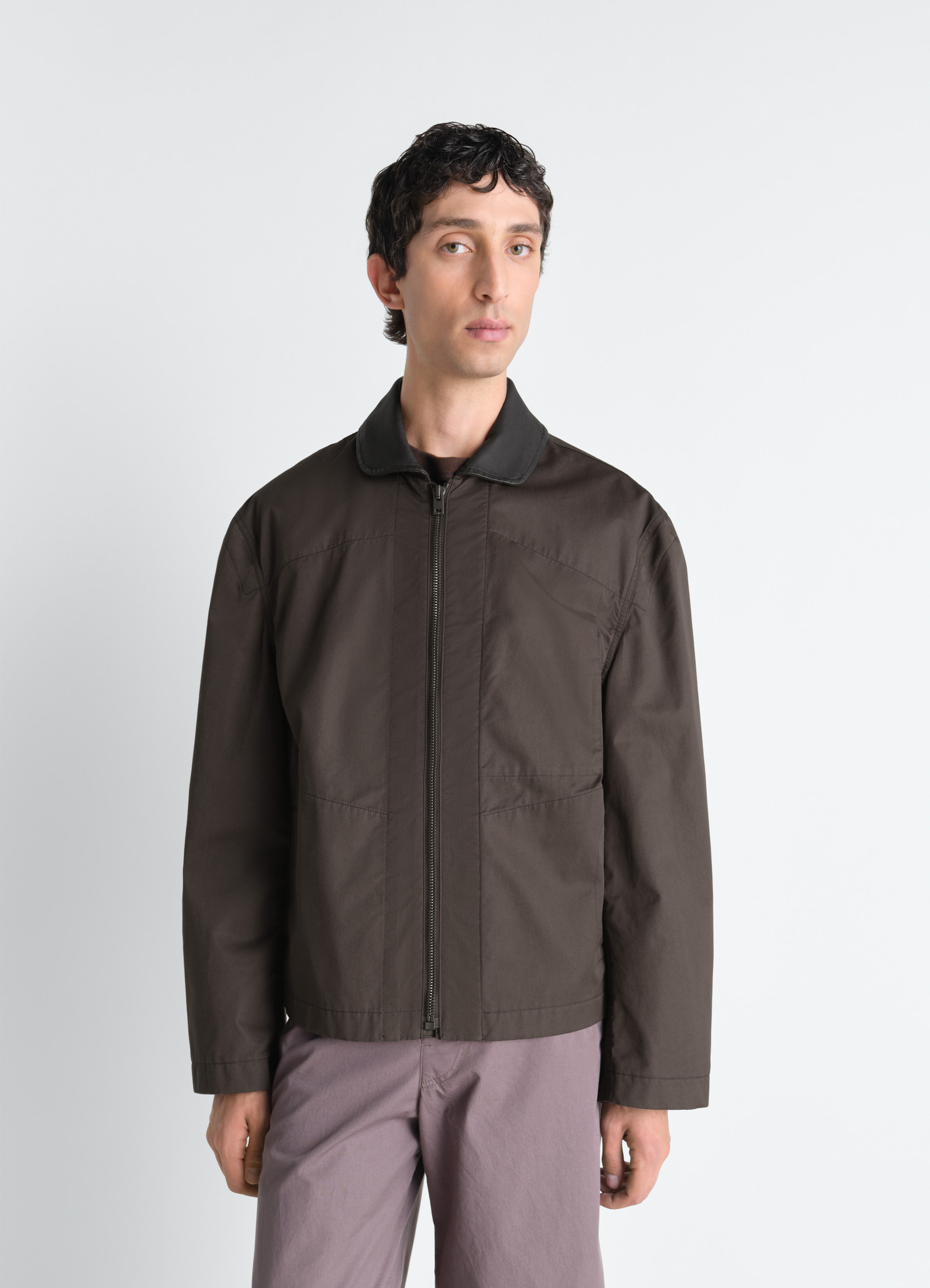 Leather collar blouson in cotton twill, model shot, three-quarter view zip-up closure visible