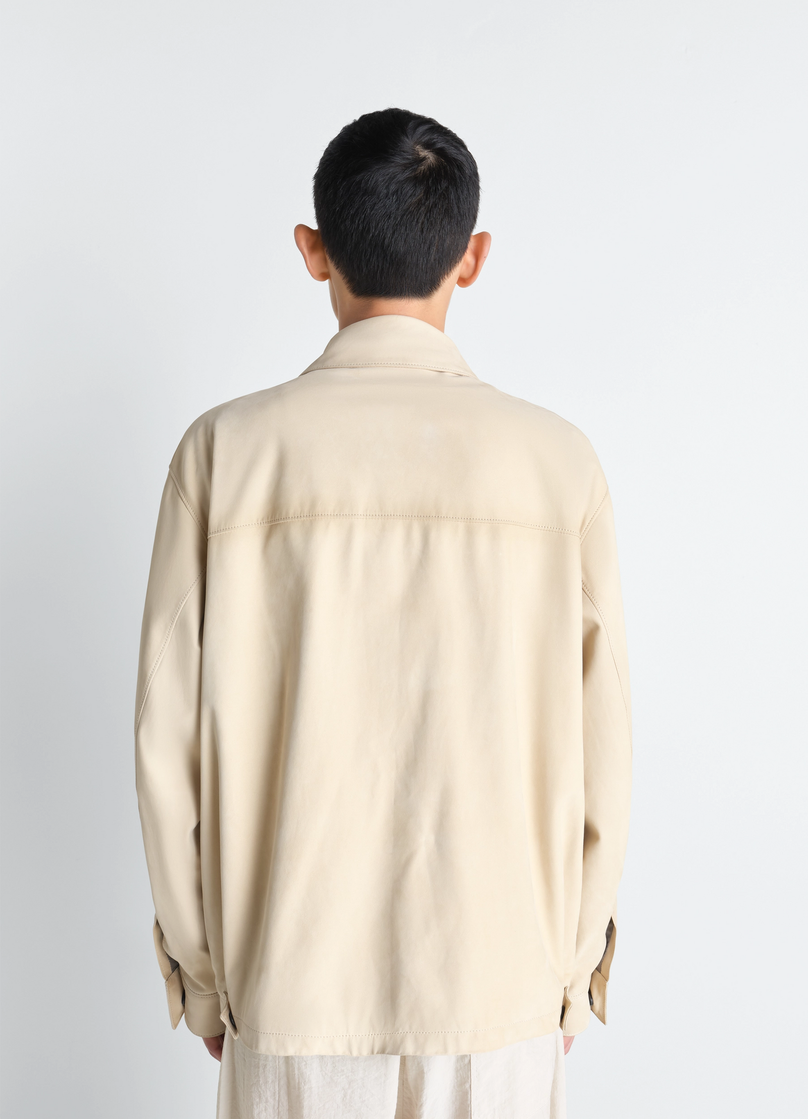 Reporter jacket in nubuck, model shot, back view dropped shoulder seam