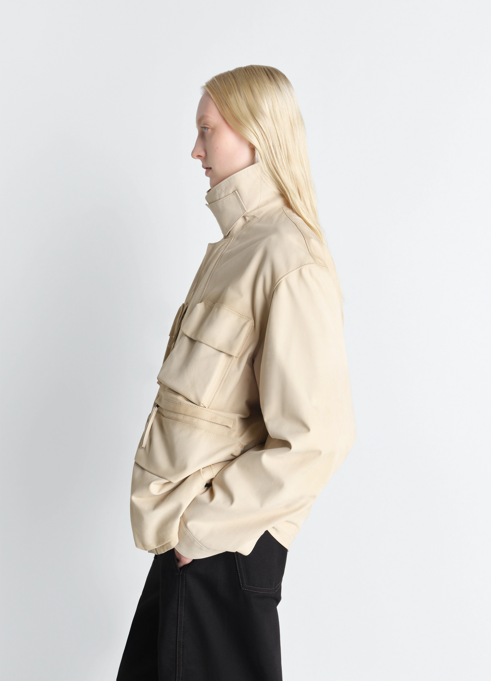 Reporter jacket in nubuck, model shot, profile view adjustable waist belt