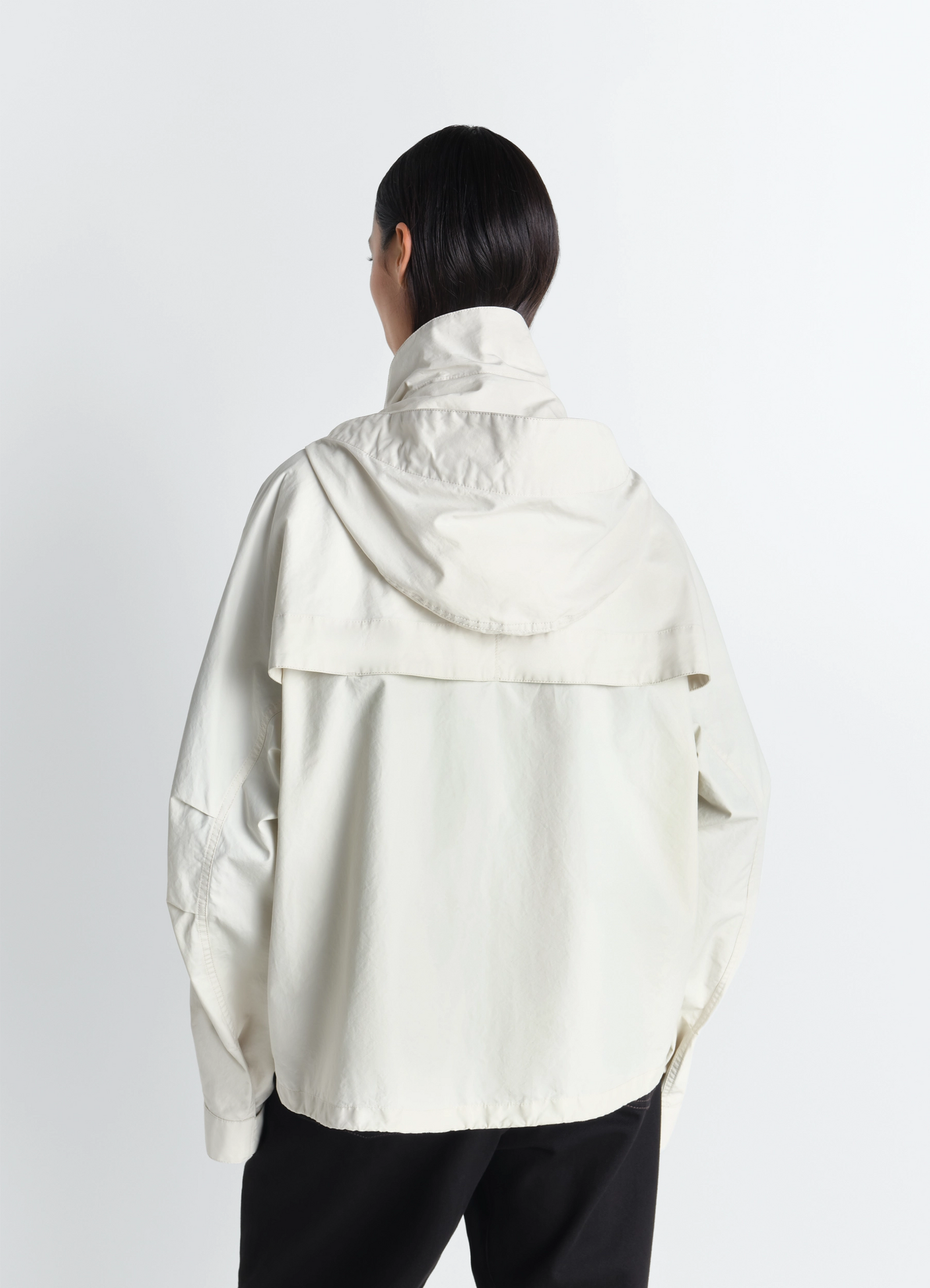 Short rain parka in ventile® cotton, model shot, rear left view draped back hood