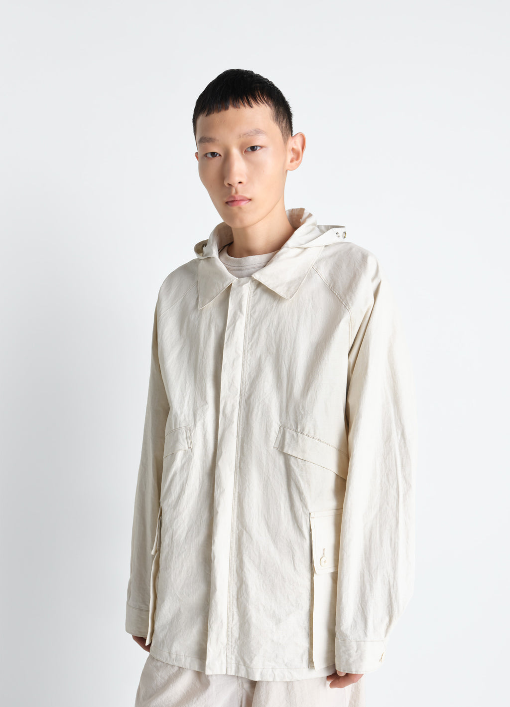 Rain jacket with detachable hood in coated technical linen