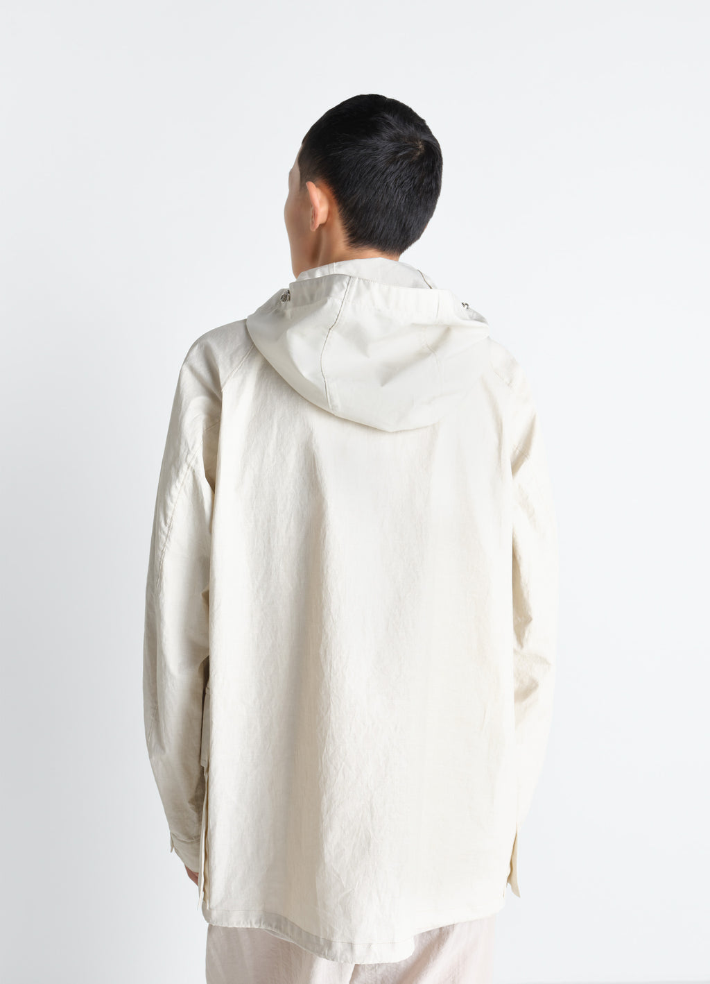 Rain jacket with detachable hood in coated technical linen