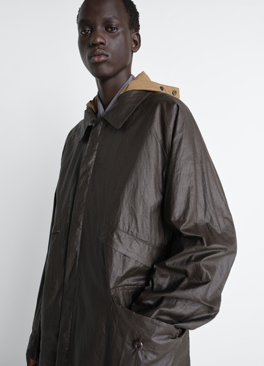 Rain jacket with detachable hood in coated technical linen