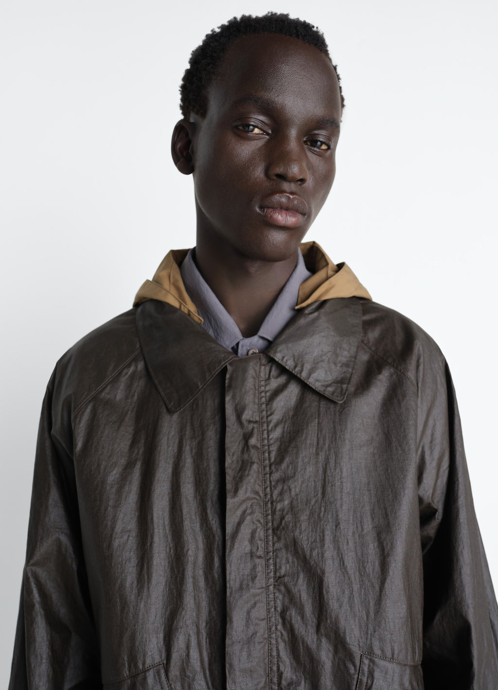Rain jacket with detachable hood in coated technical linen