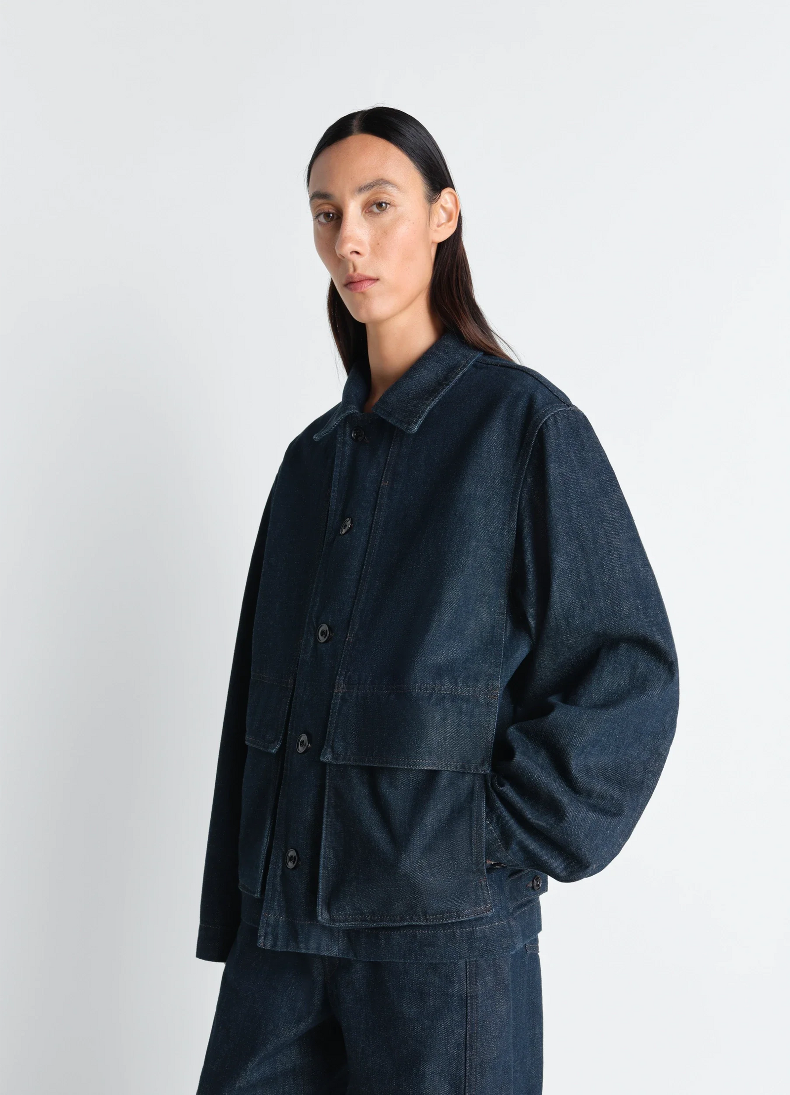 Boxy jacket in indigo denim in indigo denim, model shot, three-quarter view oversized buttons, patch pockets