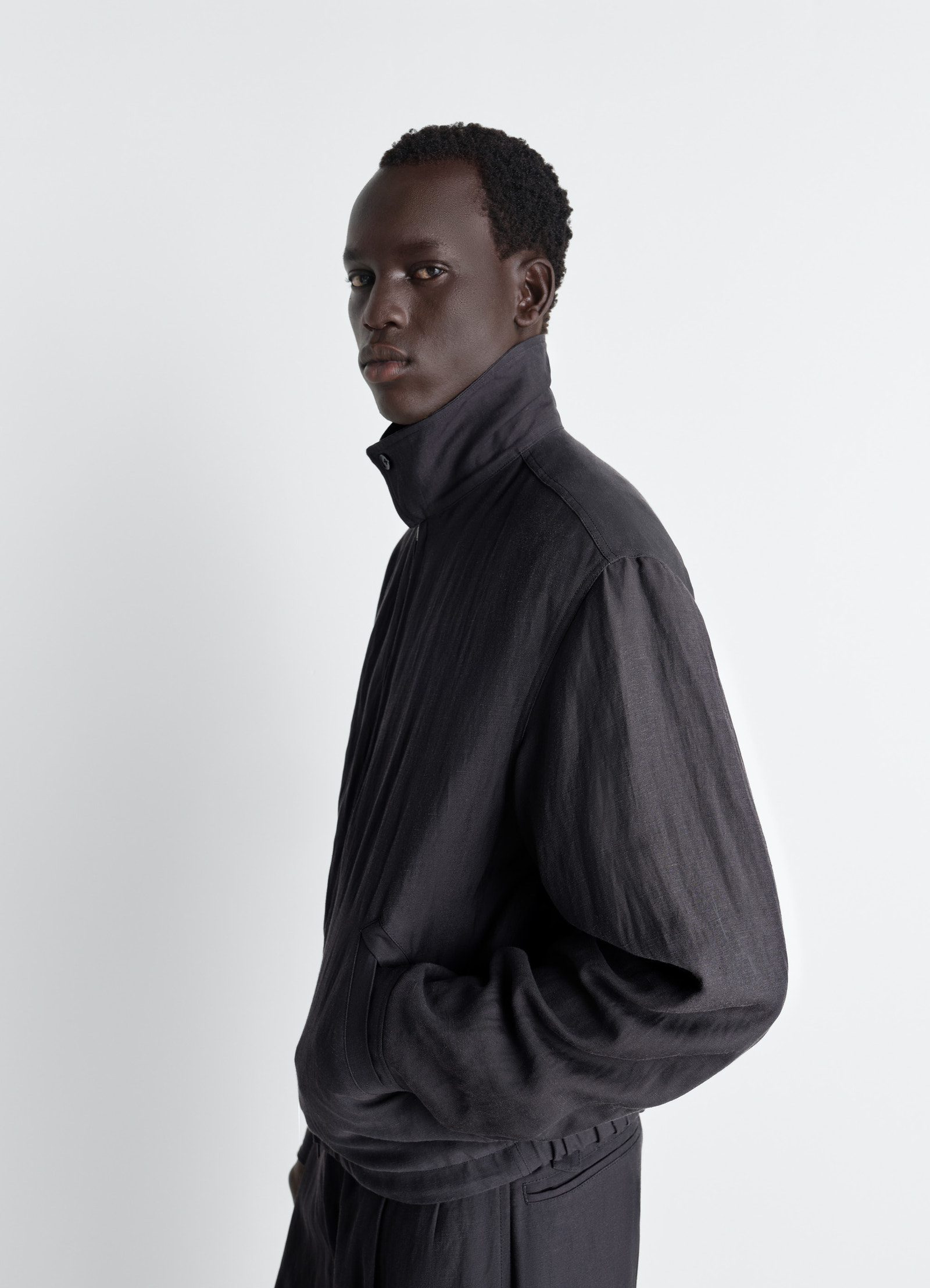 Short blouson in viscose linen gabardine, model shot, side view high collar relaxed fit